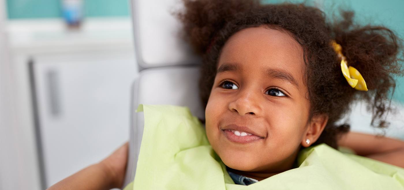 Little girl in dental chair smiling after receiving children's dentistry in Allen Texas