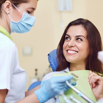 Patient and dentist discussing dental crowns in Allen