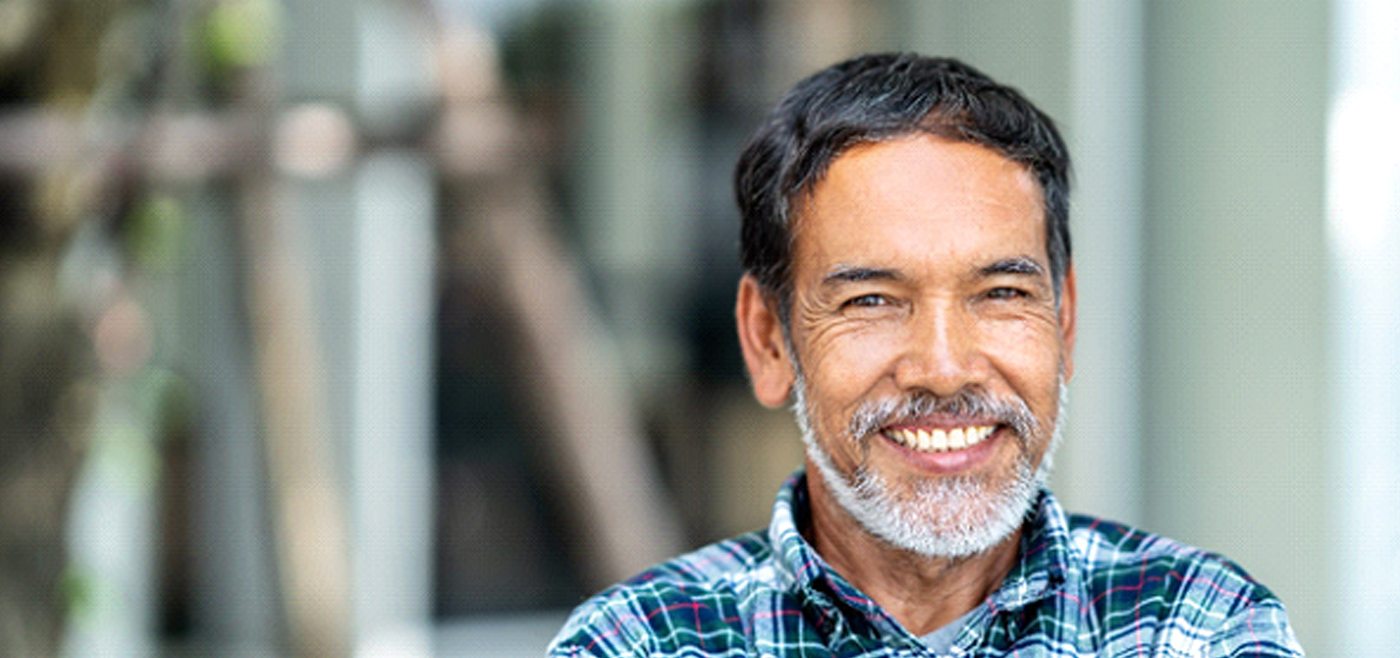 Man smiling with dental bridge in Allen