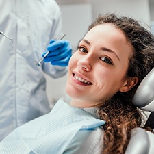 Young woman at routine checkup with her dentist