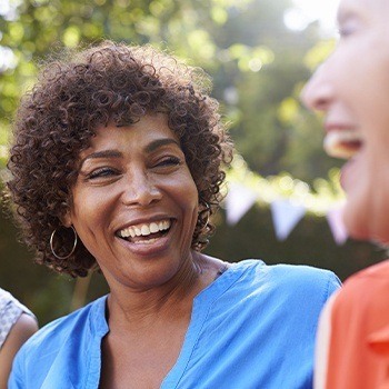 Woman with beautiful smile after dental implants