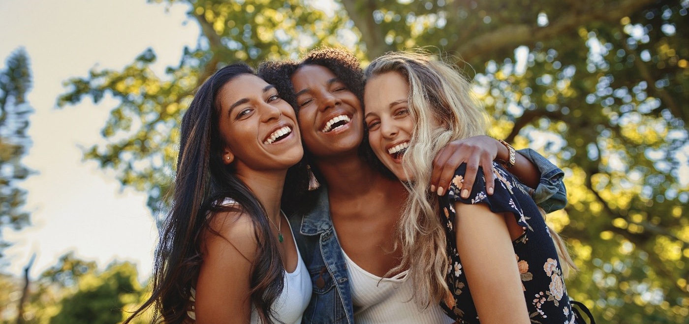 friends smiling and wearing Invisalign in Allen