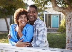 Man and woman smiling together outdoors