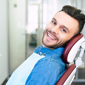 Man smiling at dentist’s office in Allen