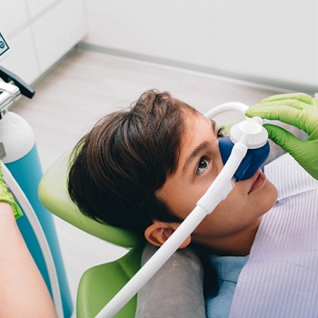 child receiving nitrous oxide sedation at the dentist’s office