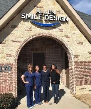Allen dentist and team members standing outside of dental office