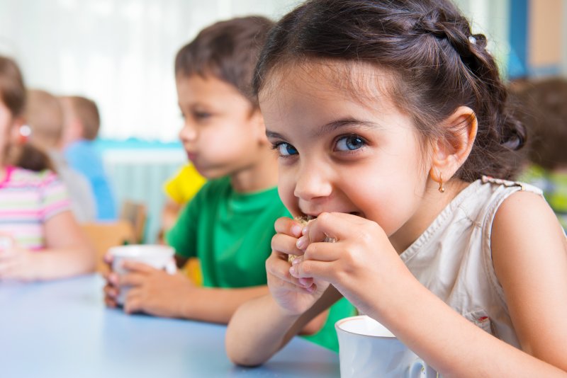 Child eating snack at school