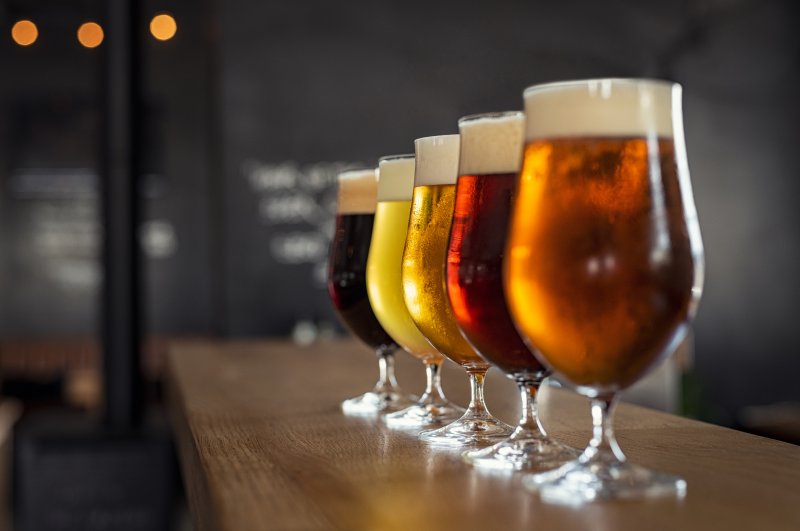 Line up of different colored beers