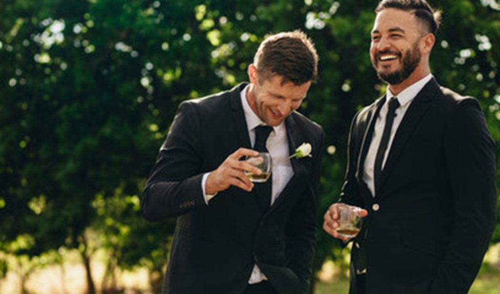 People attending a black-tie event after receiving teeth whitening treatment.