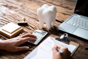 Patient filling out dental insurance forms.