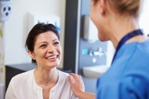 a patient visiting her cosmetic dentist 